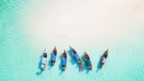 12 Sunny Beaches Around the World to Float in Luxury